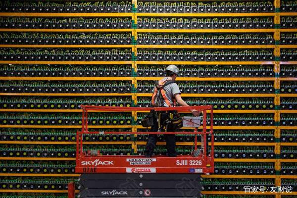 A close up shot of a miner examining the circuit board of a mining rig