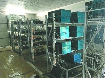 A sprawling cryptocurrency mining farm with rows of operational miners