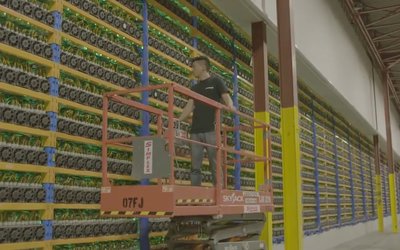 Expansive mining farm with rows of servers glowing